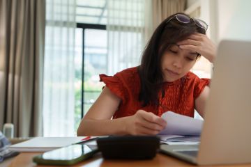 Focusing lady on paperwork
